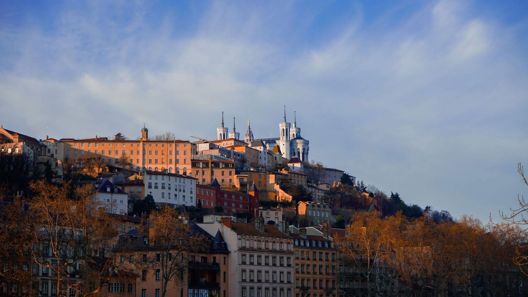 Lyon city skyline with the Fourvière basilica at golden hour